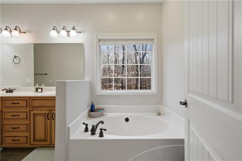 323 Lloyd Way Resaca, GA 30735 - Photo 6 of 43 a bathroom with a bathtub and a sink