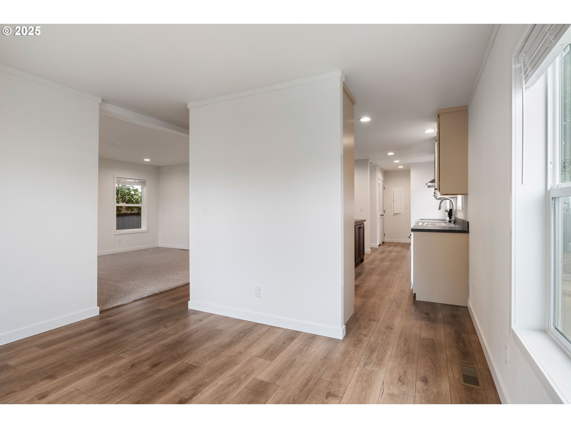 631 East Ellendale Avenue, Unit 206 Dallas, OR 97338 - Photo 12 of 30 a view of kitchen with refrigerator and wooden floor