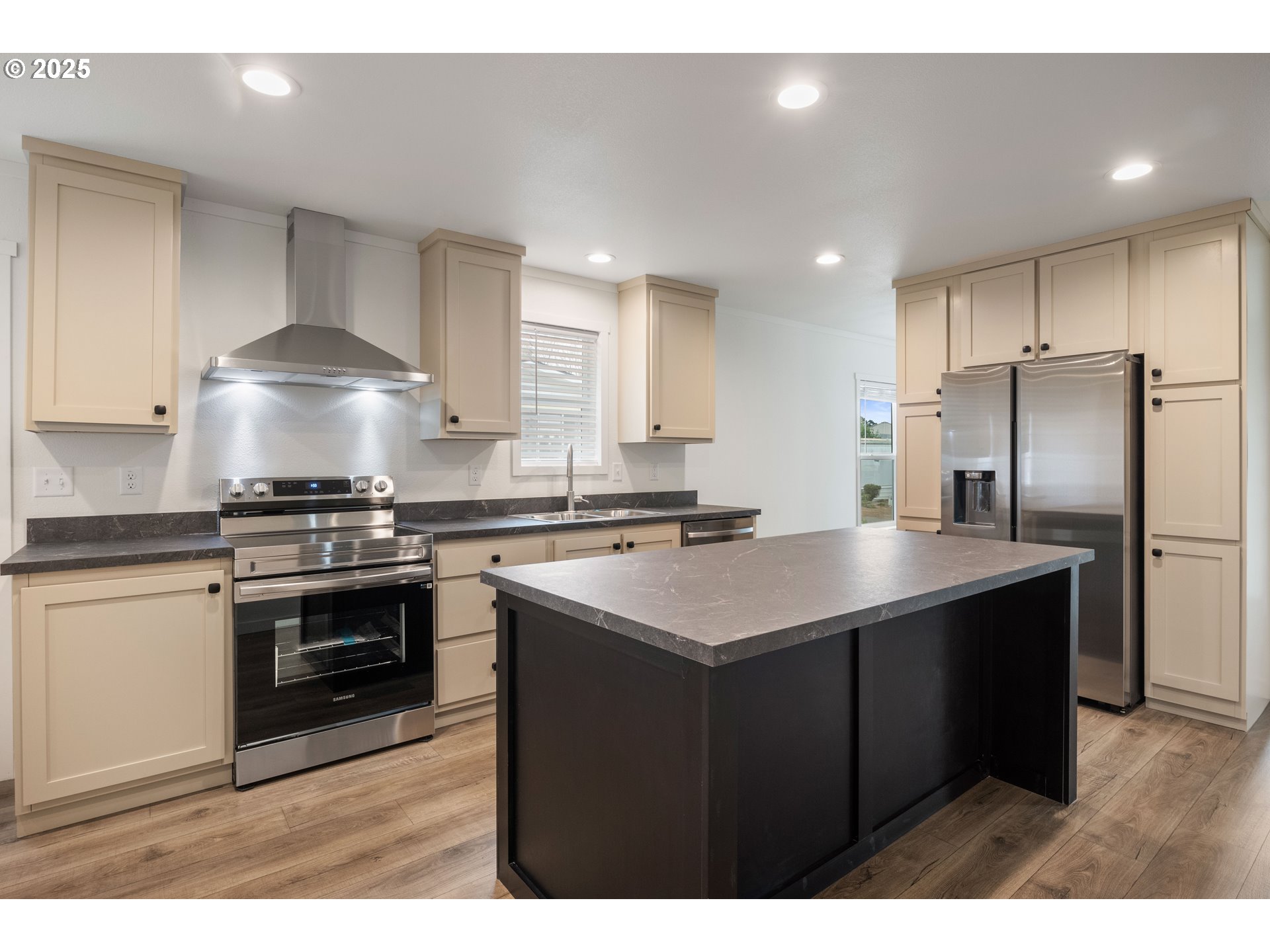 631 East Ellendale Avenue, Unit 206 Dallas, OR 97338 - Photo 15 of 30 a kitchen with stainless steel appliances a sink stove and refrigerator