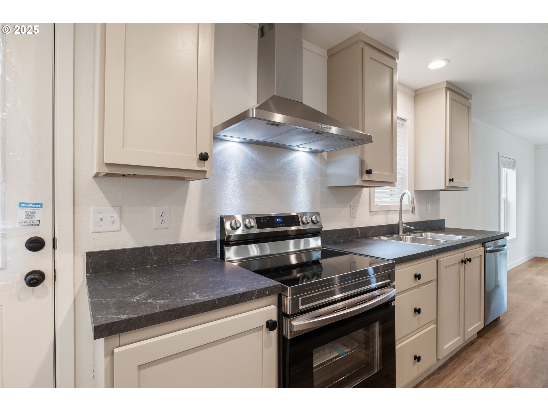 631 East Ellendale Avenue, Unit 206 Dallas, OR 97338 - Photo 16 of 30 a kitchen with stainless steel appliances granite countertop a stove and a sink