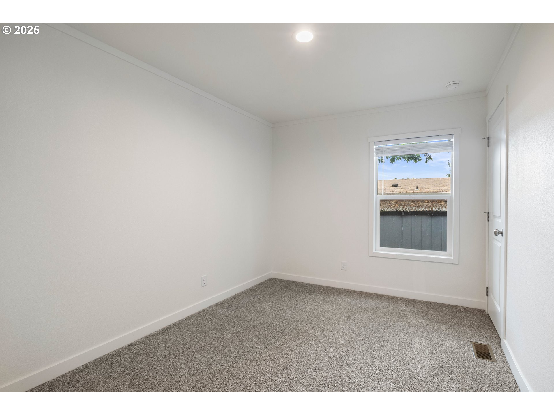 631 East Ellendale Avenue, Unit 206 Dallas, OR 97338 - Photo 19 of 30 a view of an empty room with a window