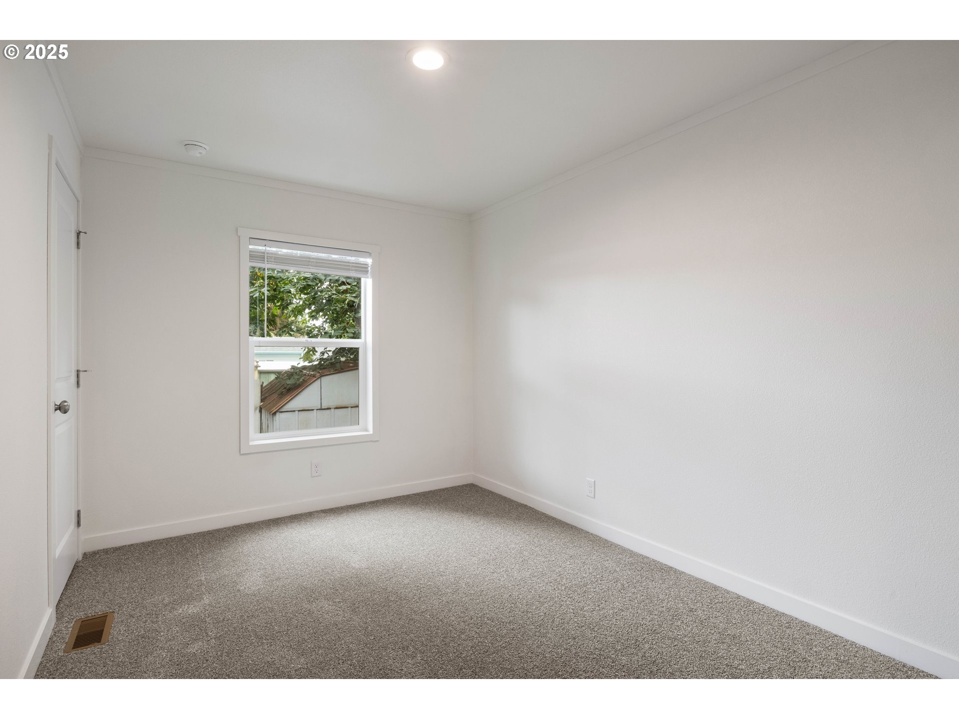 631 East Ellendale Avenue, Unit 206 Dallas, OR 97338 - Photo 22 of 30 a view of an empty room with a window
