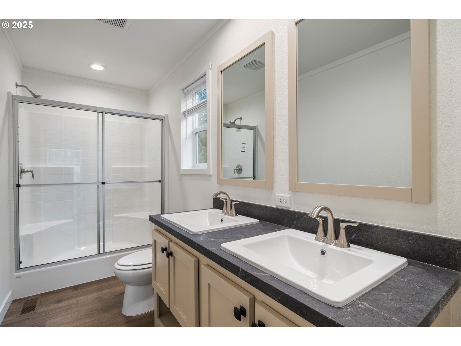 631 East Ellendale Avenue, Unit 206 Dallas, OR 97338 - Photo 28 of 30 a bathroom with a sink toilet a mirror and shower