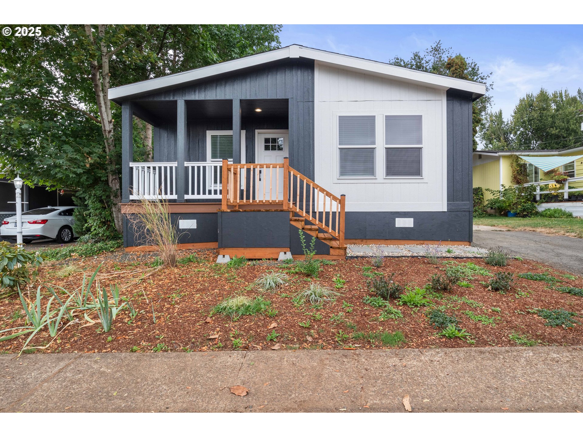 631 East Ellendale Avenue, Unit 206 Dallas, OR 97338 - Photo 3 of 30 a front view of a house with a yard