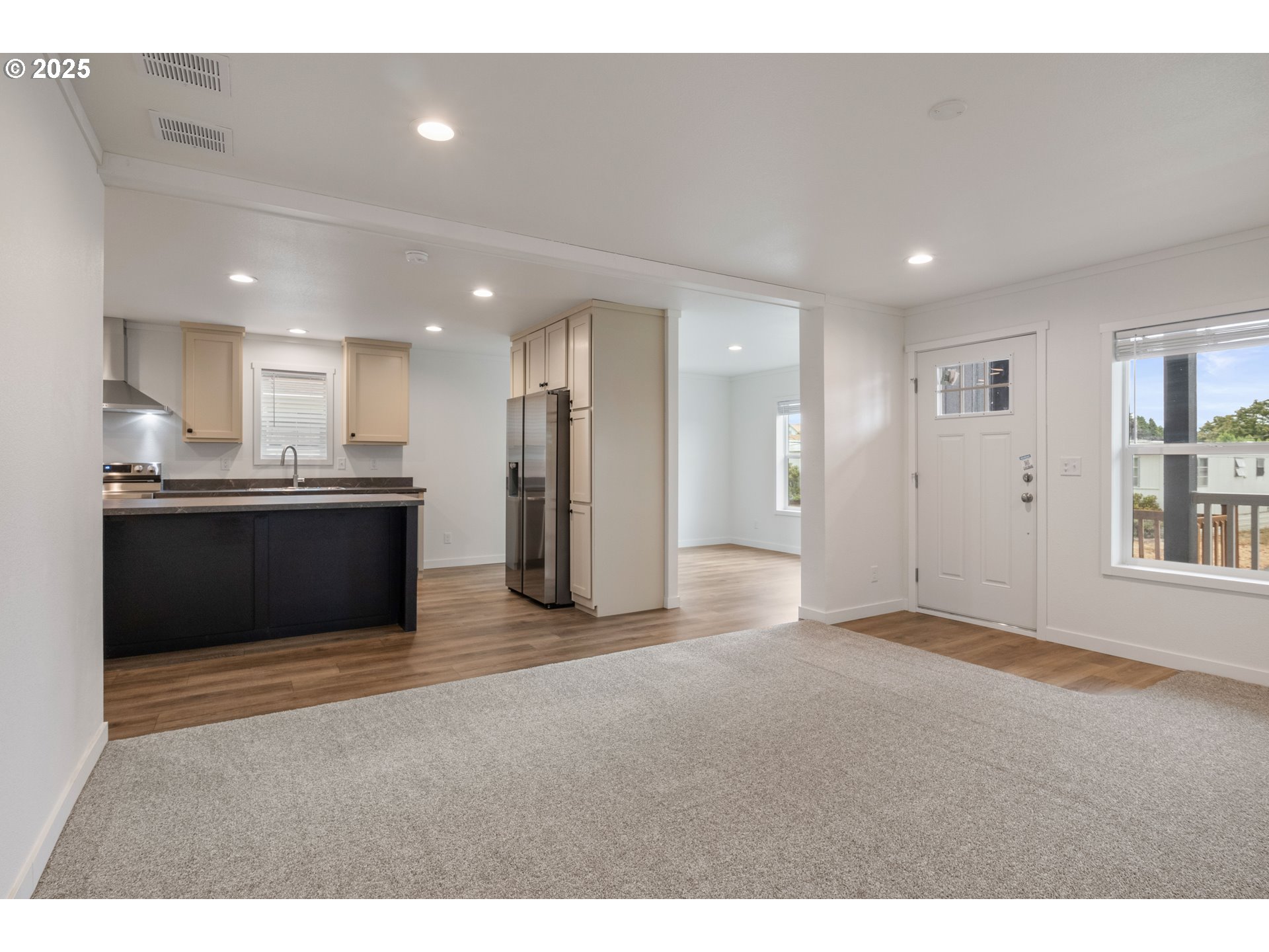 631 East Ellendale Avenue, Unit 206 Dallas, OR 97338 - Photo 8 of 30 a view of kitchen with refrigerator and windows
