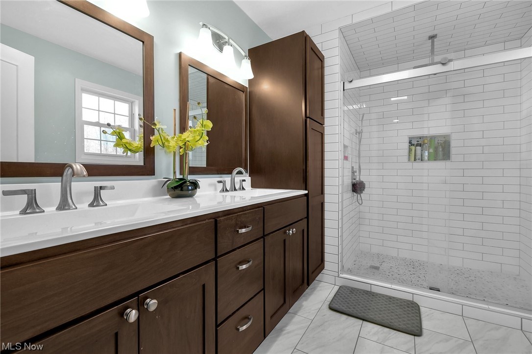 4900 Ellerman Road Zanesville, OH 43701 - Photo 20 of 28 Bathroom with tile flooring, double sink vanity, and a shower with shower door