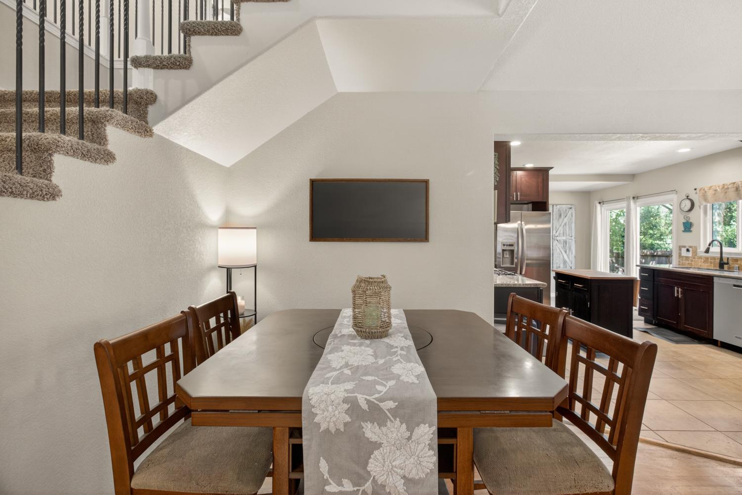 6332 Horseshoe Bar Road Loomis, CA 95650 - Photo 15 of 85 Carpeted staircase with black iron balusters