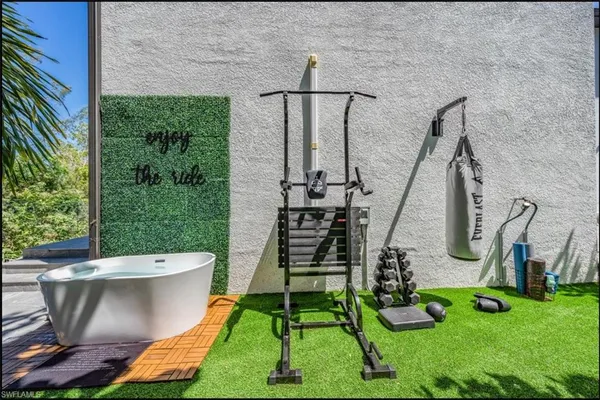 a balcony with table and chairs