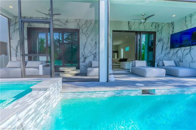 a view of living room kitchen with furniture and floor to ceiling window