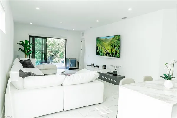 a bedroom with a bed and a couch