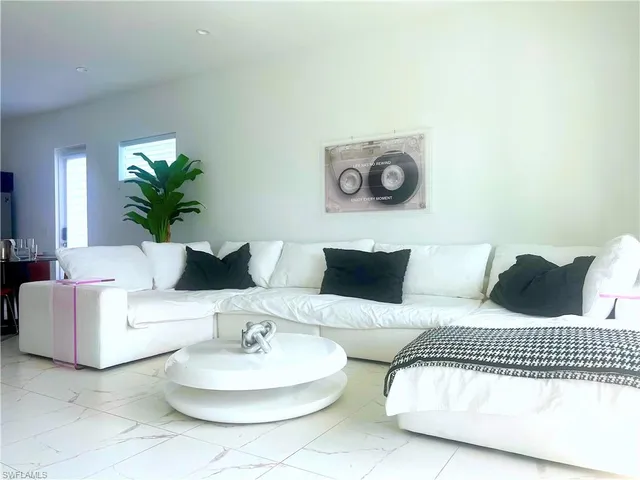 a kitchen with a sink cabinets and window