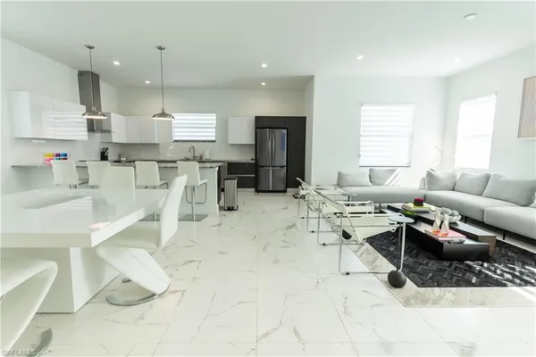 a kitchen with a table and chairs