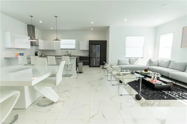 a kitchen with a table and chairs