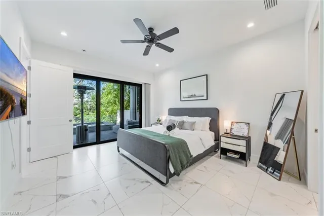 a bedroom with bed and window