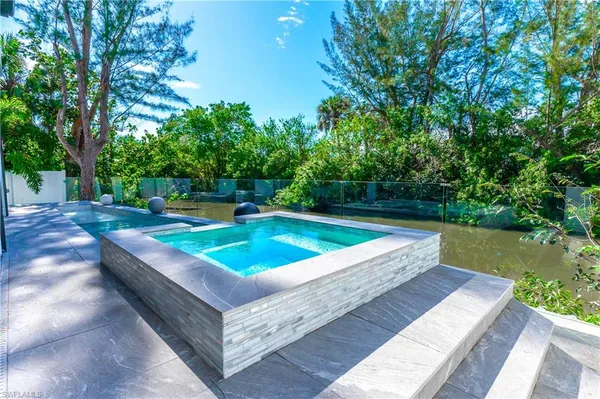 a view of a backyard with a small pool
