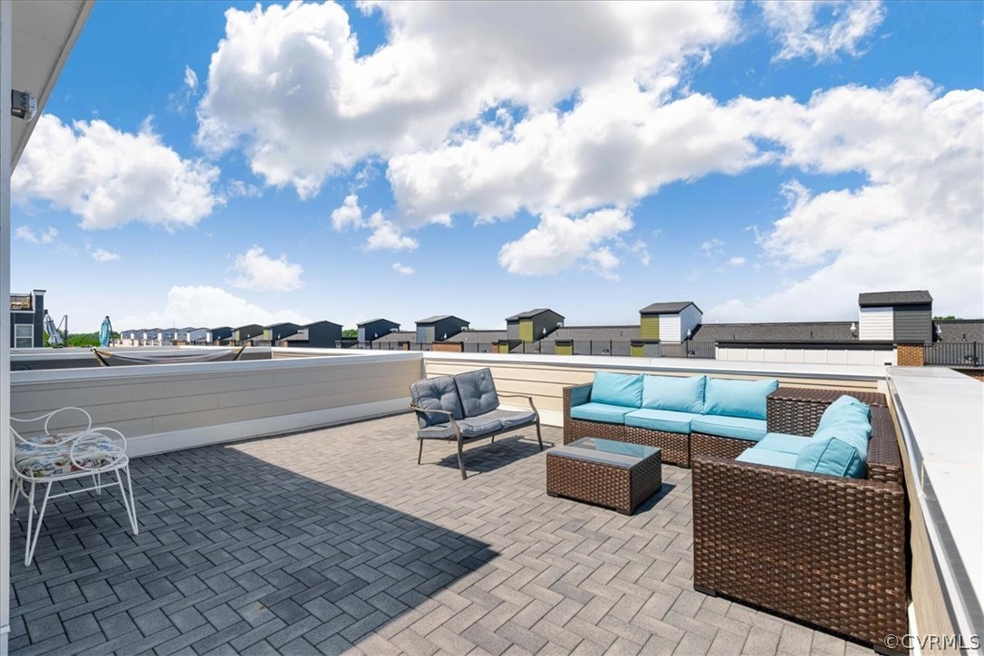a view of roof deck with seating space and barbeque oven
