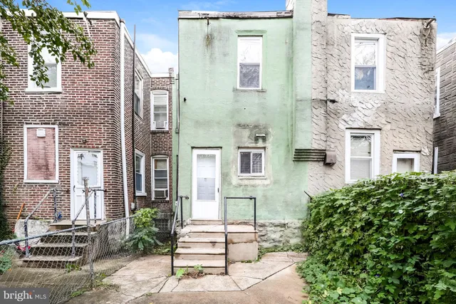 a view of a brick buildings with many windows