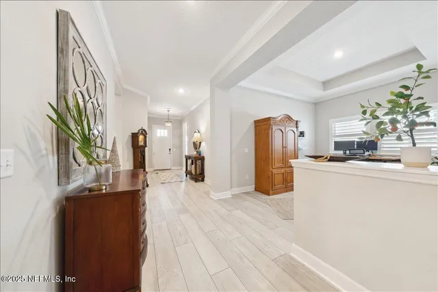 a kitchen with stainless steel appliances kitchen island granite countertop a refrigerator and a sink