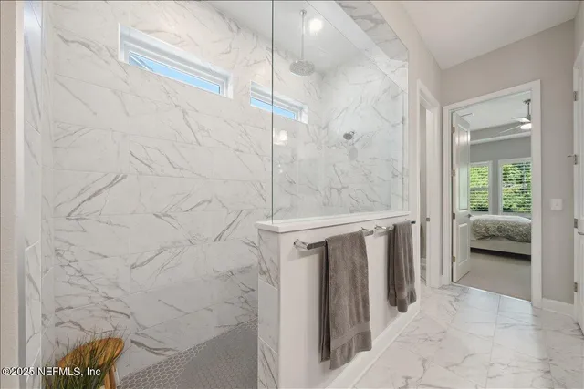 a bathroom with a shower and a sink