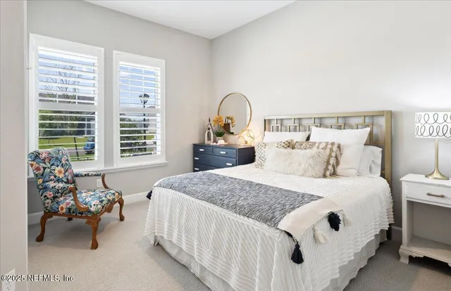 a bedroom with bed and a window