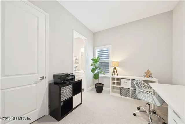 a view of a workspace with furniture