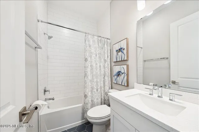 a bathroom with a sink a toilet and a bathtub