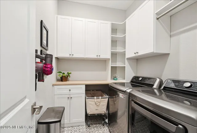 a kitchen with a sink cabinets and stove top oven