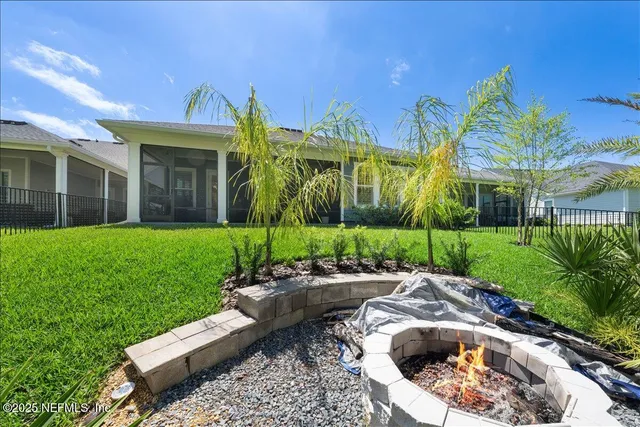 a view of a house with garden and swimming pool