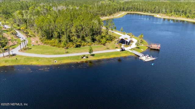 a view of a swimming pool with an outdoor space and seating area