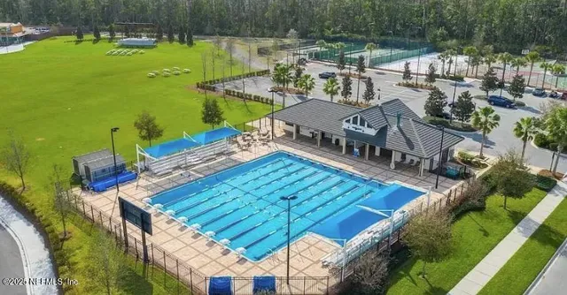 a view of a house with a yard from a balcony