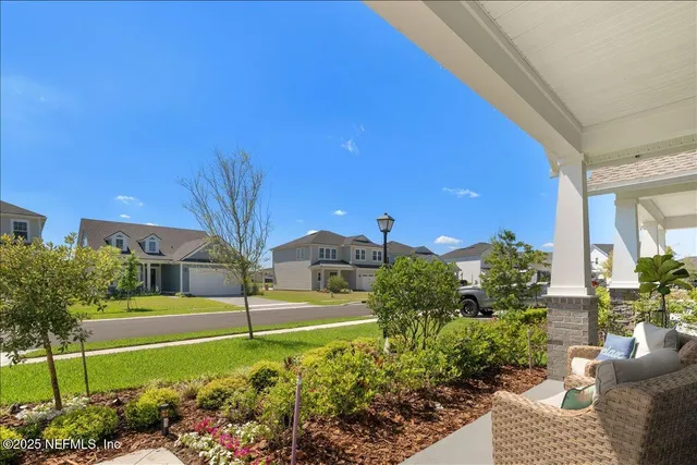 a view of a garden with a house