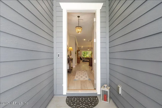 a view of a wooden door and front door