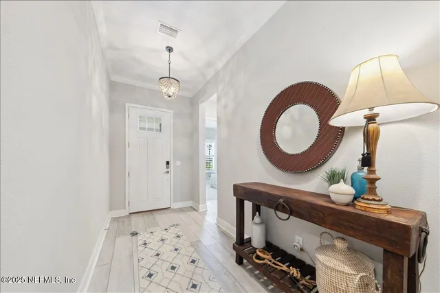 a living room with furniture and a mirror