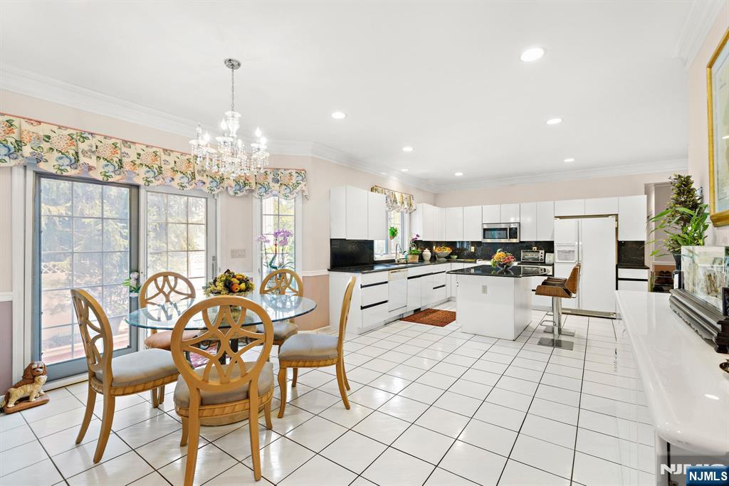 163 Rutherford Road Mahwah, NJ 07430 - Photo 13 of 33 a view of a dining room and livingroom with furniture wooden floor a chandelier
