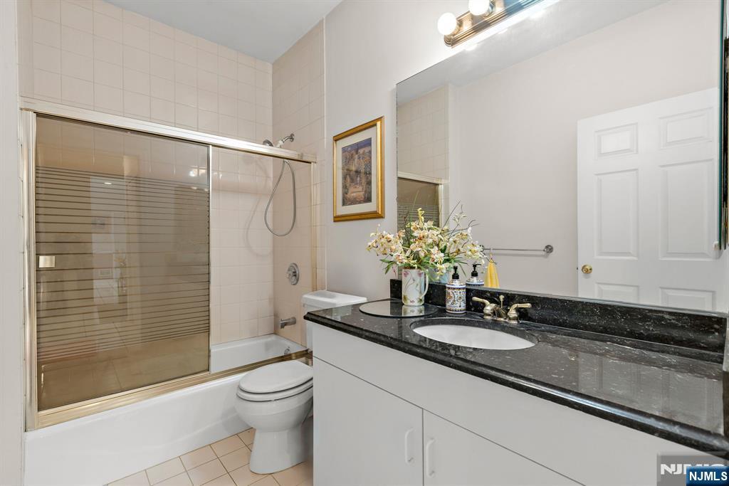 163 Rutherford Road Mahwah, NJ 07430 - Photo 16 of 33 a bathroom with a granite countertop sink a toilet and shower