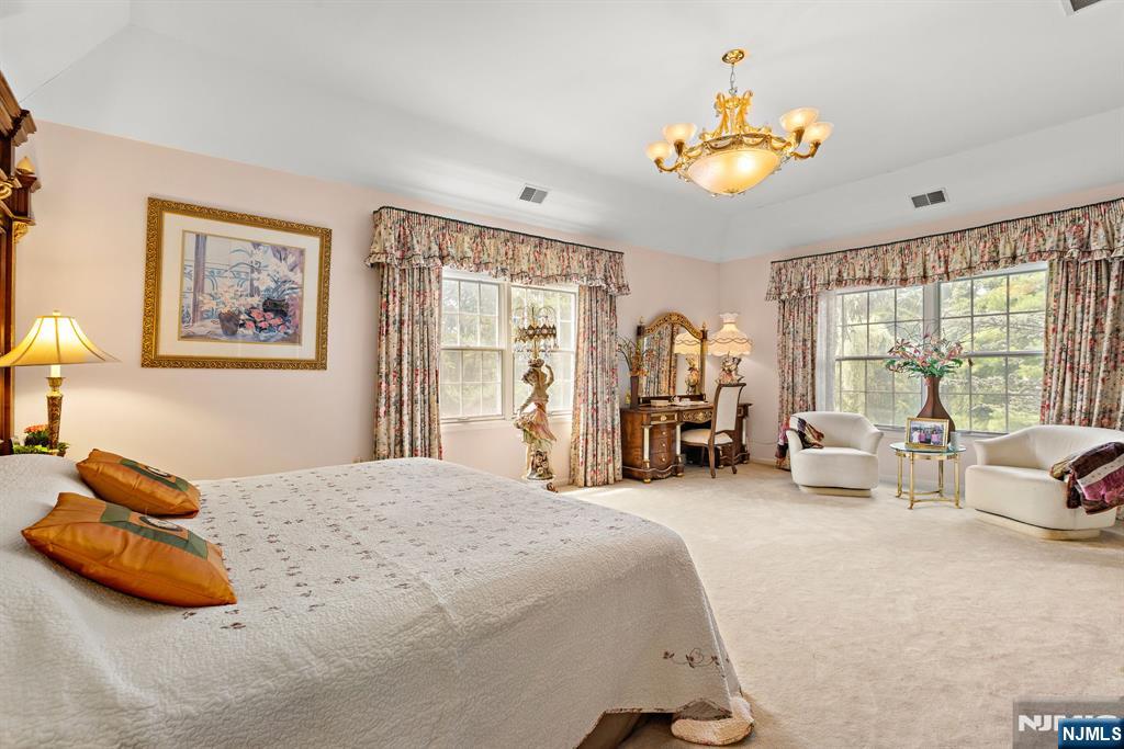 163 Rutherford Road Mahwah, NJ 07430 - Photo 20 of 33 a bedroom with a bed and a large mirror