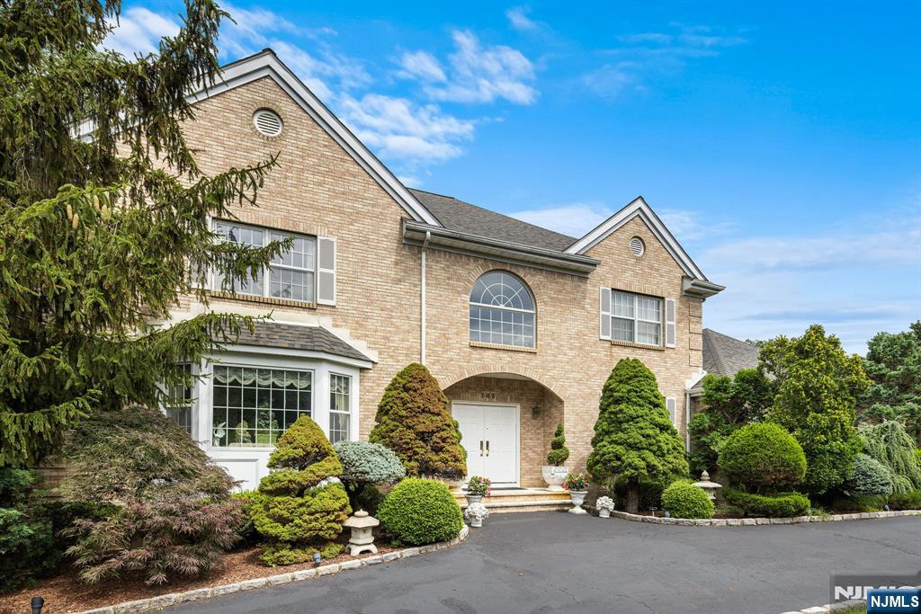 163 Rutherford Road Mahwah, NJ 07430 - Photo 2 of 33 a front view of a house with a yard