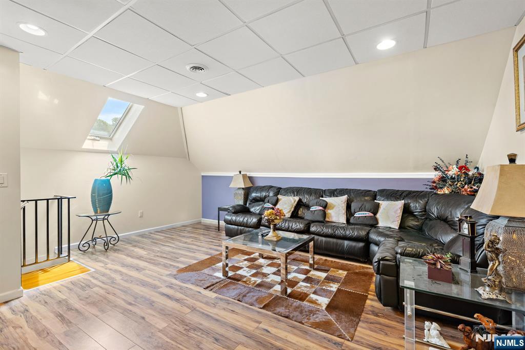 163 Rutherford Road Mahwah, NJ 07430 - Photo 27 of 33 a living room with furniture and wooden floor