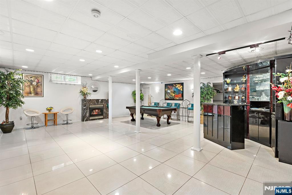 163 Rutherford Road Mahwah, NJ 07430 - Photo 28 of 33 a view of a room with lots of chairs and potted plants