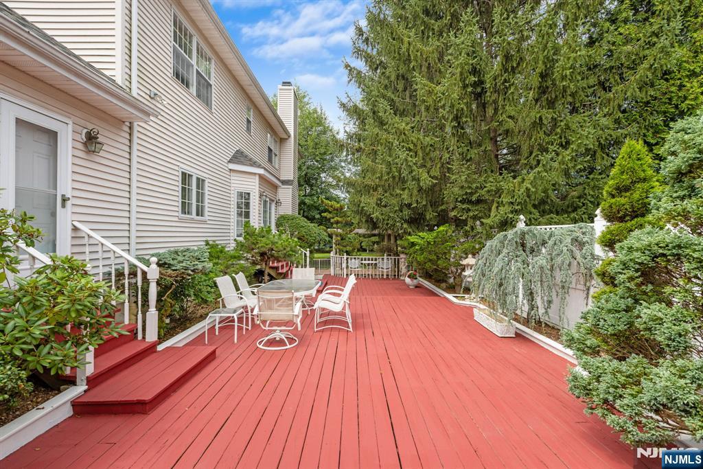 163 Rutherford Road Mahwah, NJ 07430 - Photo 31 of 33 a balcony with wooden floor table and chairs