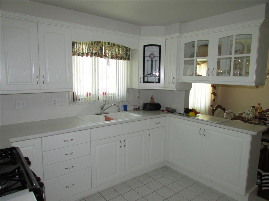 255 Rock Run Road Elizabeth, PA 15037 - Photo 12 of 25 Beautiful white kitchen open to dining room