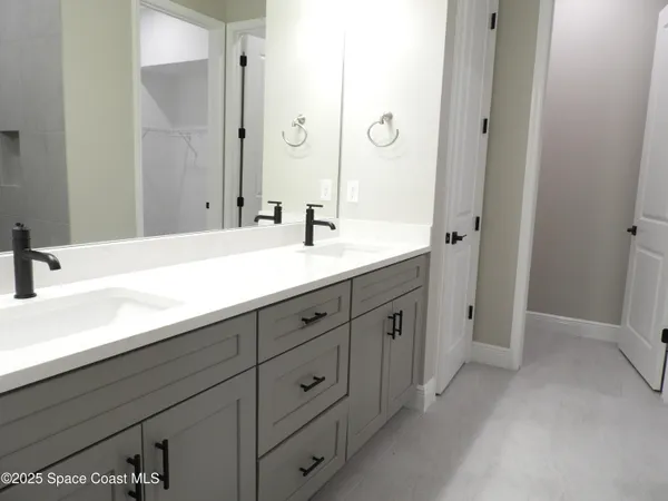 a white toilet sitting next to a shower