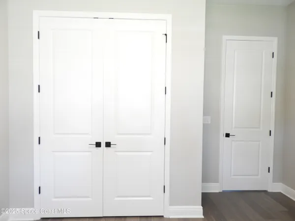 a view of a small space with wooden floor