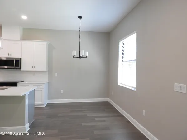 a view of a kitchen with a sink and dishwasher