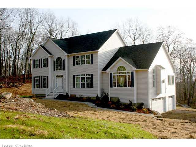 90 Hoseye Coach Road Newtown, CT 06482 - Photo 1 of 1 a front view of a house with a yard