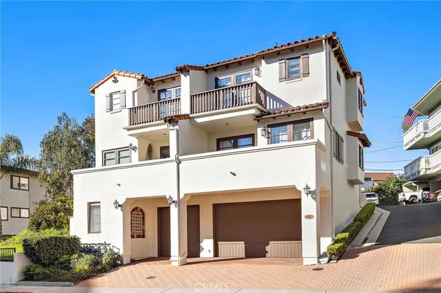a view of a white building among the street