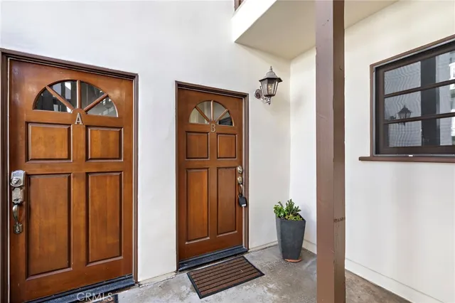 a view of front door with wooden floor