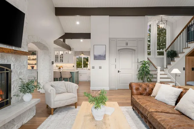 a large kitchen with stainless steel appliances kitchen island a stove and a sink