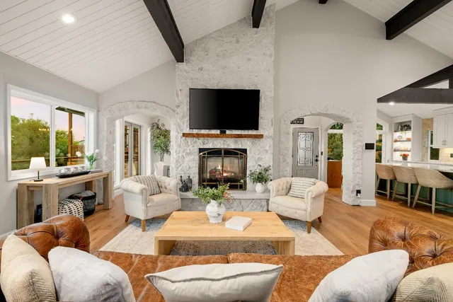 a bedroom with a bed and a fireplace