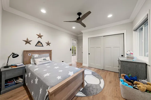 a bedroom with a bed and a fireplace